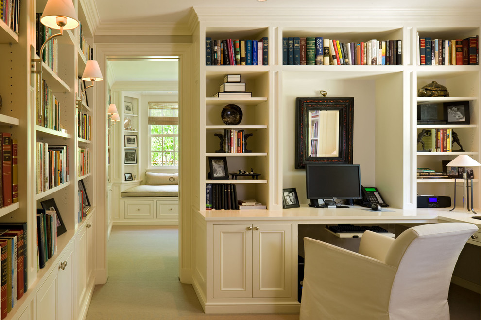 Classic home office in Denver with a built-in desk and beige walls.