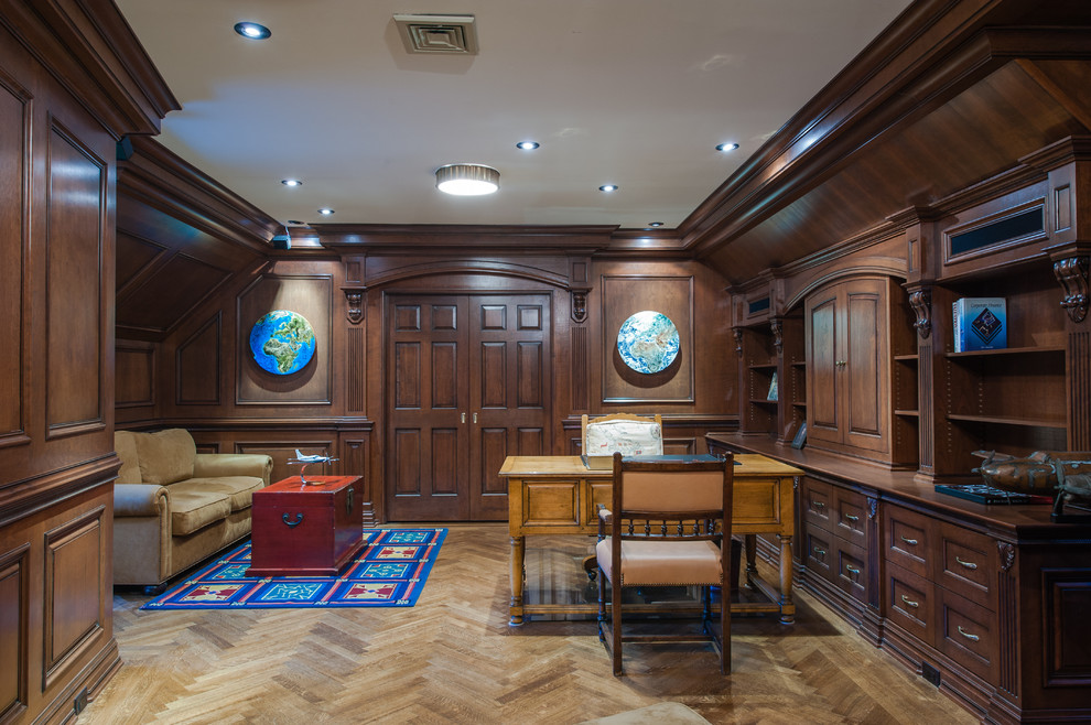 Example of a large classic freestanding desk medium tone wood floor home office design in New York