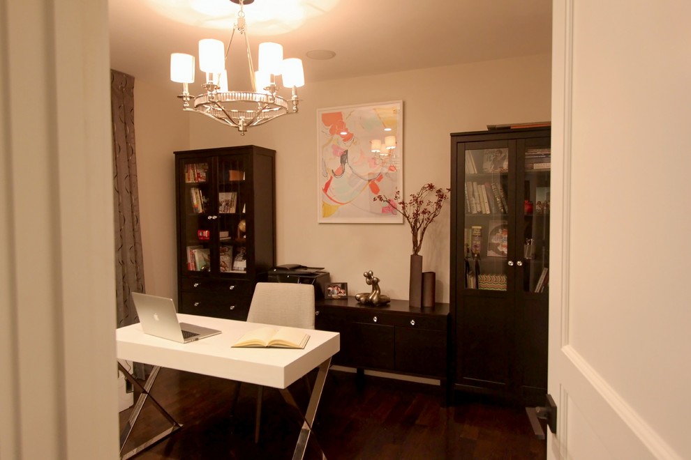 Mid-sized transitional freestanding desk dark wood floor study room photo in Boston with beige walls