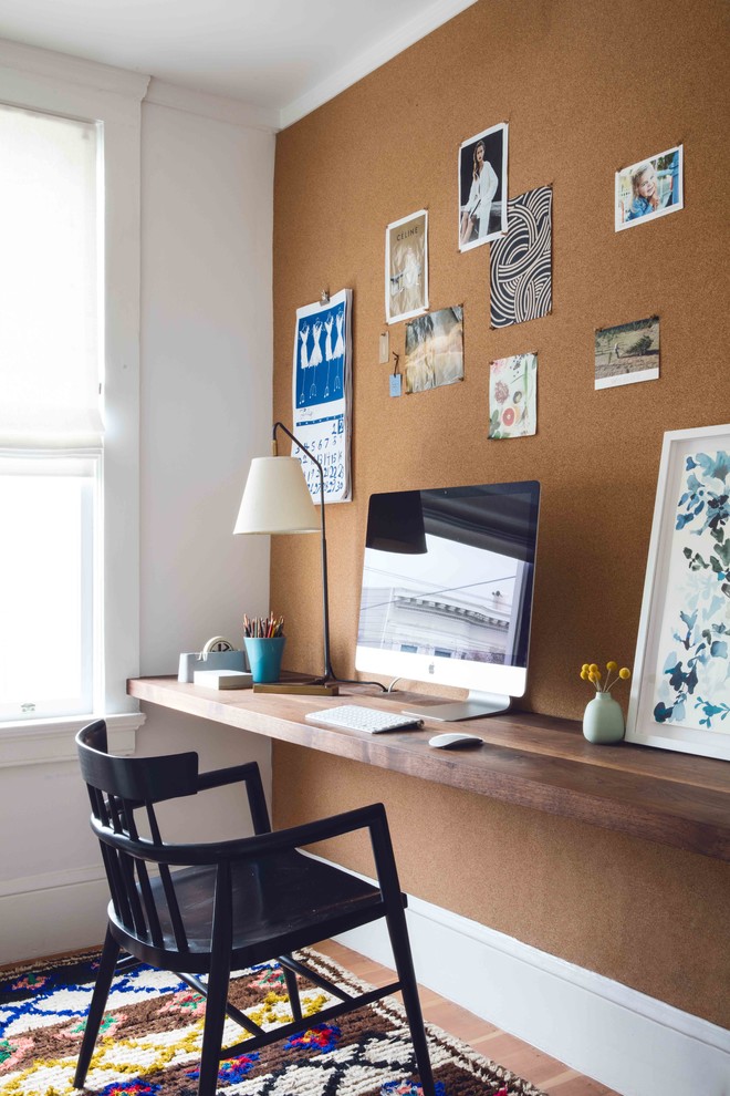 Inspiration for a small transitional built-in desk study room remodel in San Francisco with no fireplace
