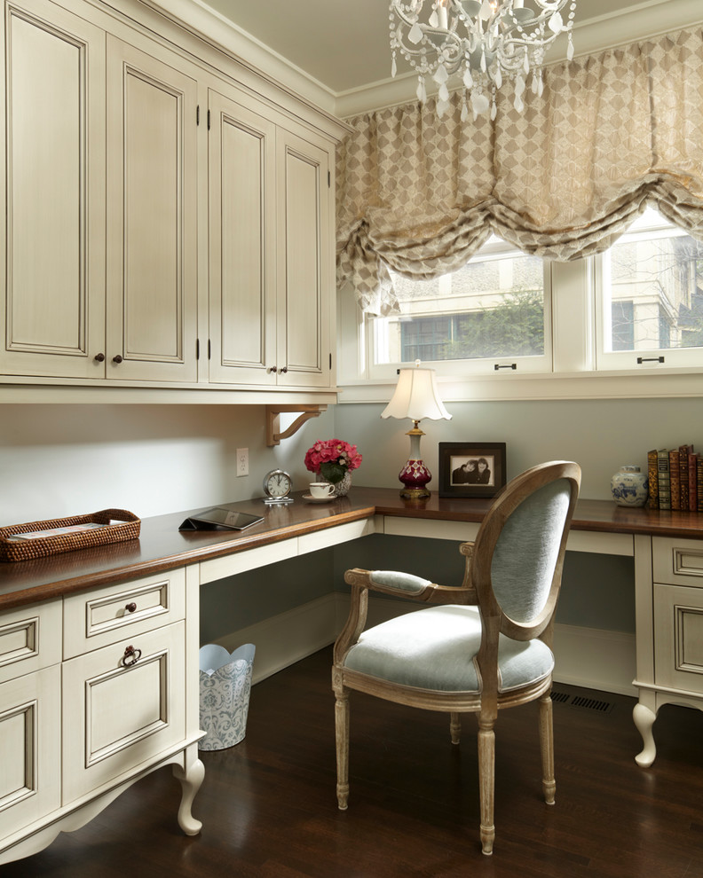 Inspiration for a victorian built-in desk dark wood floor home office remodel in Minneapolis