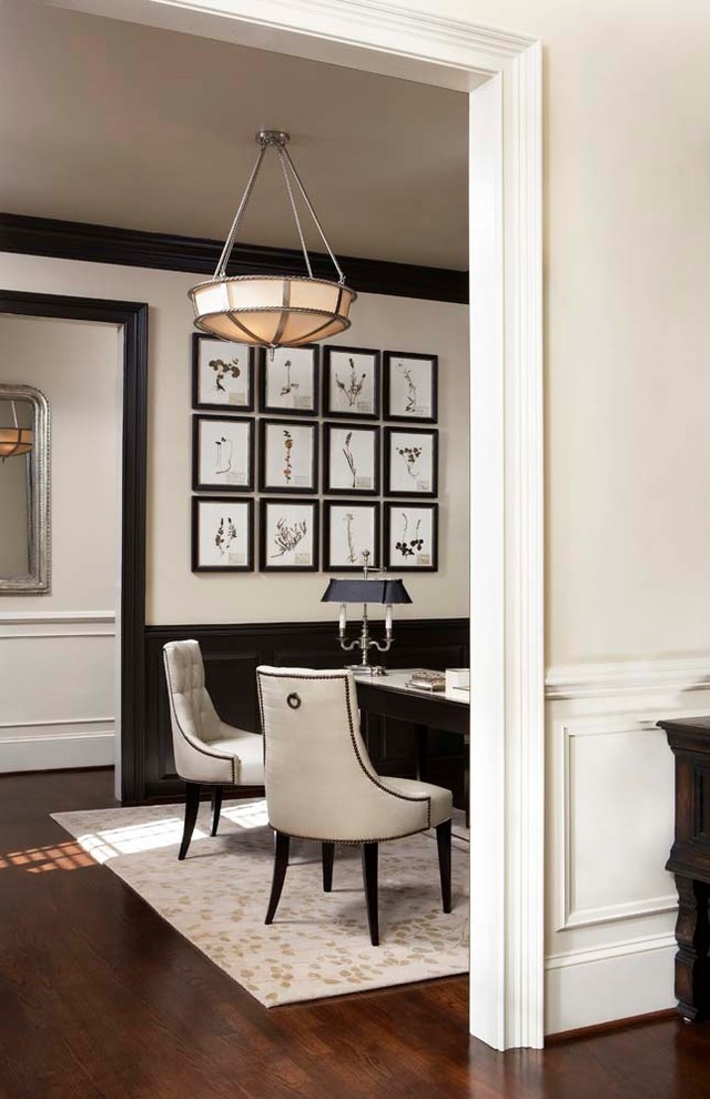 Study room - large traditional freestanding desk dark wood floor study room idea in Other with white walls