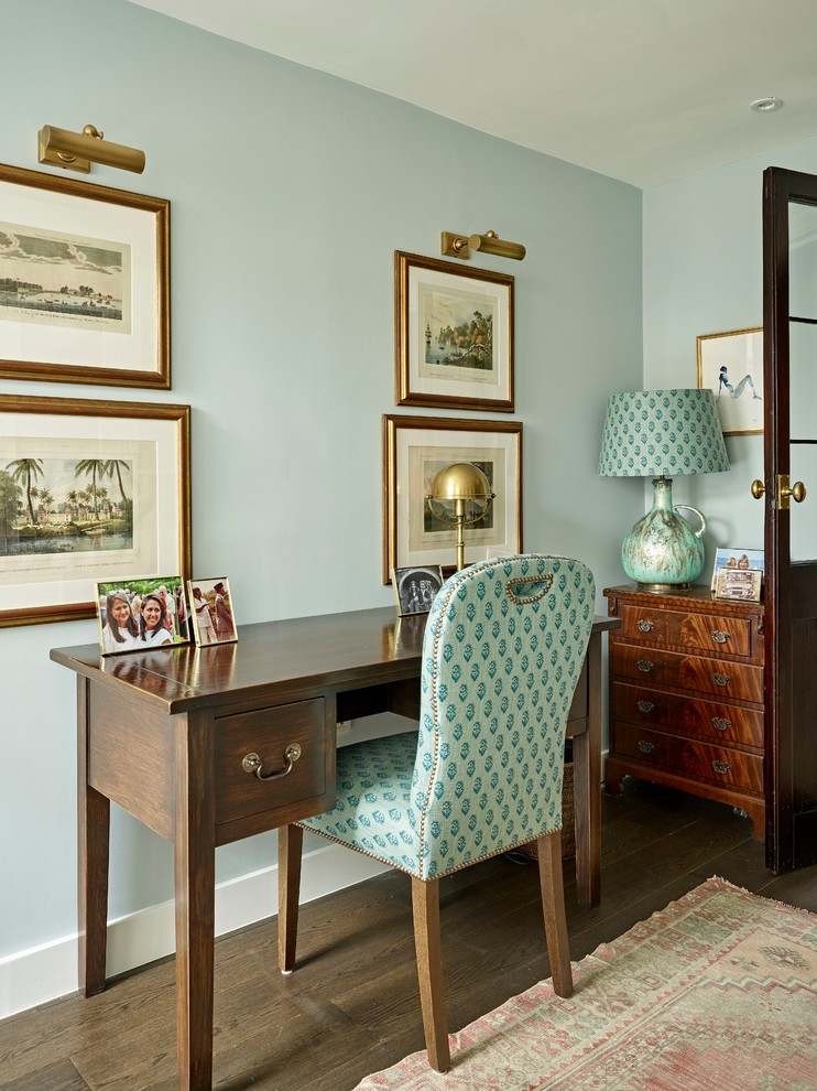 Study room - small traditional freestanding desk dark wood floor and brown floor study room idea in London with blue walls
