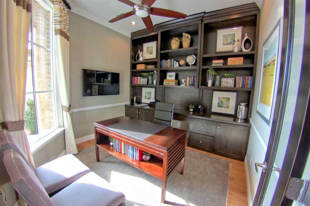 Design ideas for a classic home office in Oklahoma City with light hardwood flooring and no fireplace.