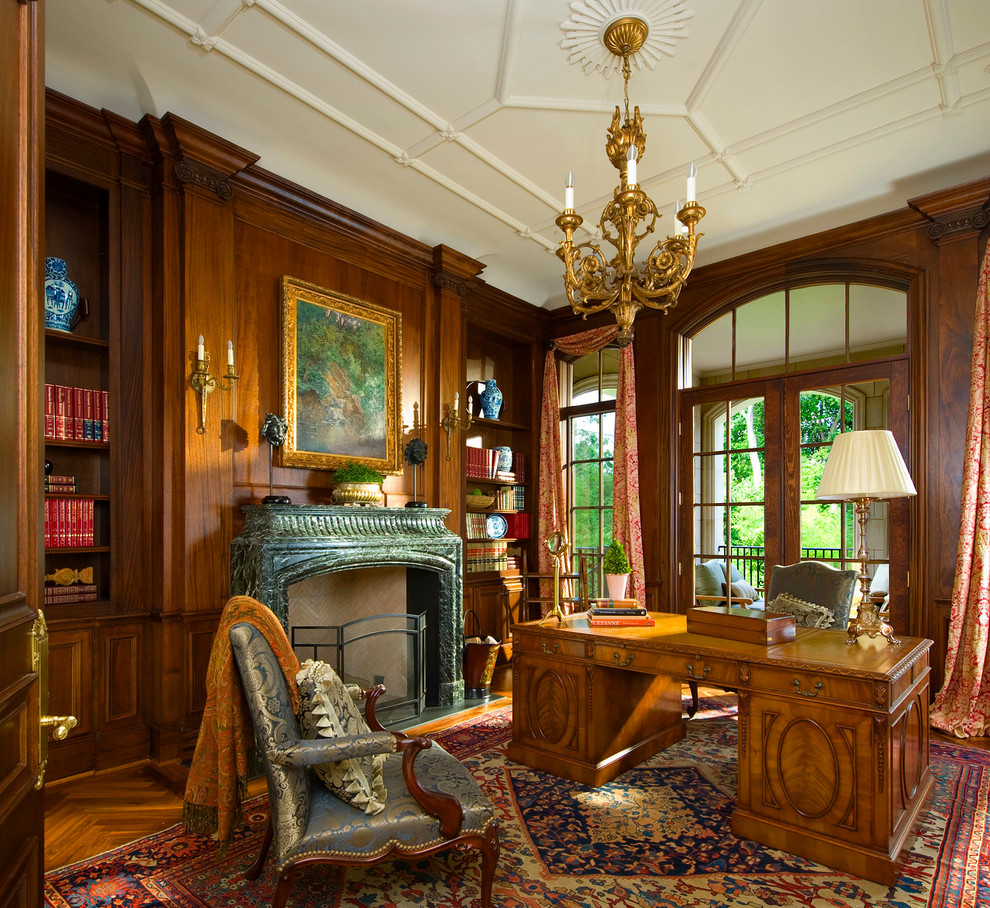 Design ideas for a classic home office in Dallas with medium hardwood flooring, a standard fireplace and a freestanding desk.