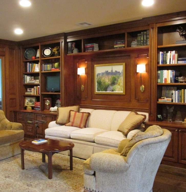 Home office library - mid-sized traditional dark wood floor home office library idea in Houston