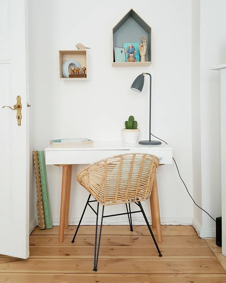 Inspiration for a small contemporary home studio in Other with white walls and a freestanding desk.