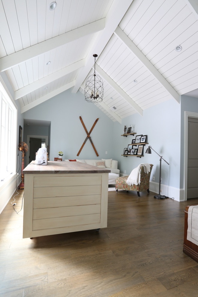 Inspiration for a mid-sized transitional built-in desk light wood floor home office remodel in Atlanta with blue walls
