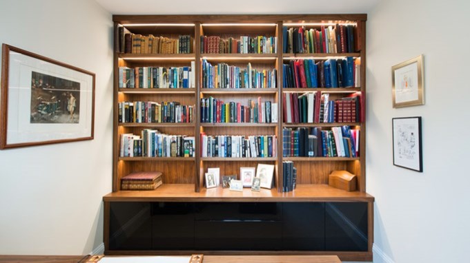 Example of a mid-sized trendy freestanding desk study room design in London with white walls