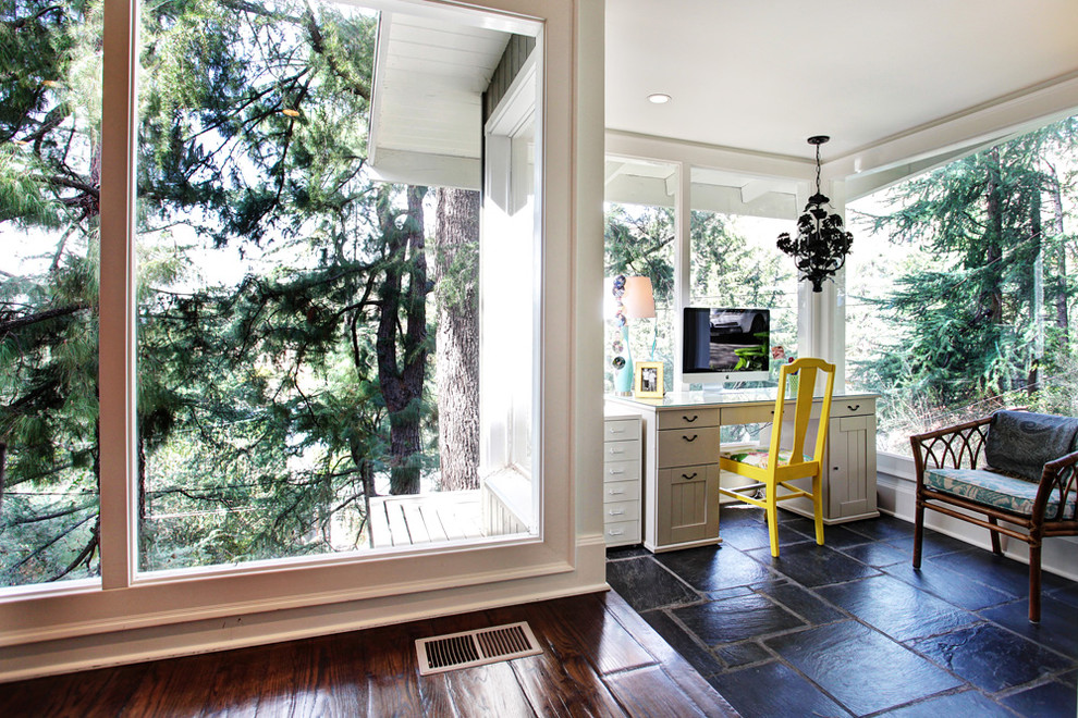Transitional freestanding desk black floor home office photo in Los Angeles
