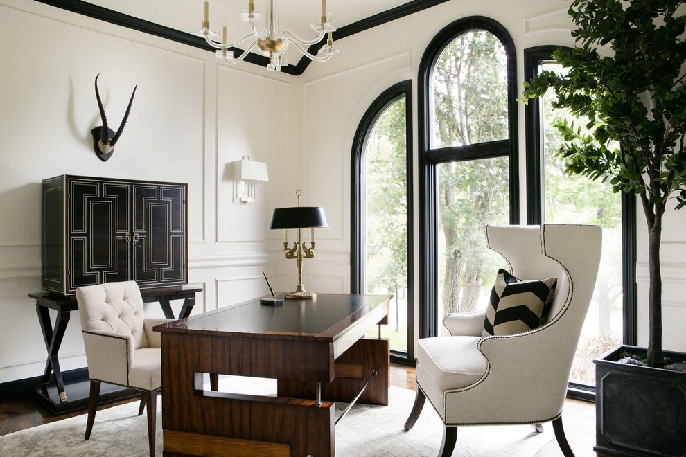 Example of a mid-sized transitional freestanding desk carpeted study room design in Kansas City with white walls and no fireplace