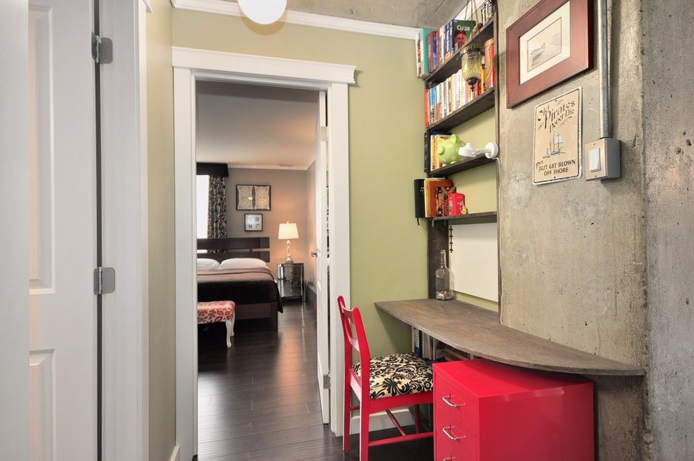 Small trendy built-in desk dark wood floor home office photo in Vancouver with green walls