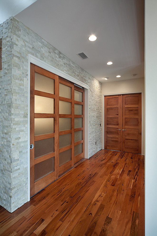 Photo of a medium sized contemporary study in San Francisco with white walls, dark hardwood flooring and brown floors.