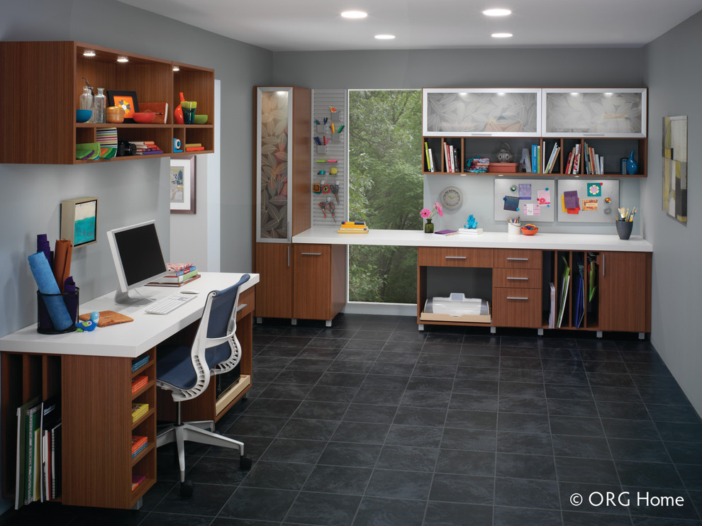 Inspiration for a large contemporary home office in Denver with grey walls and a built-in desk.