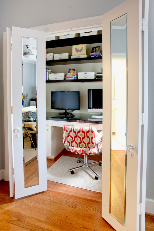 Home office with mirrored bifold doors