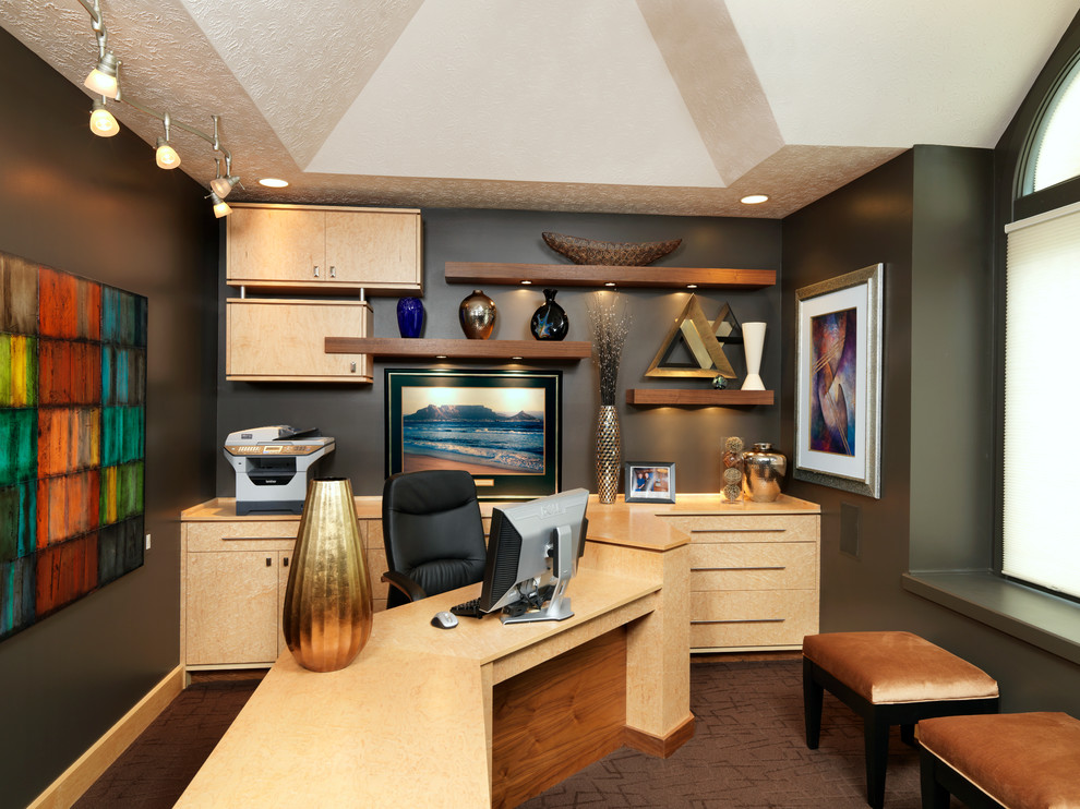 Example of a trendy built-in desk carpeted home office design in Cincinnati with gray walls