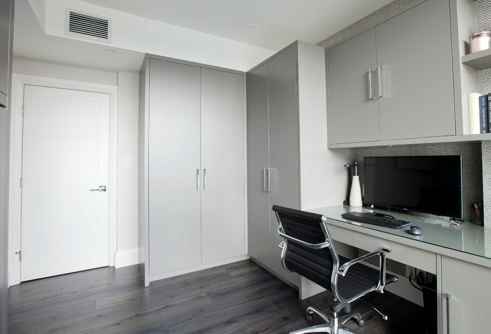 Mid-sized trendy built-in desk dark wood floor study room photo in Vancouver with gray walls and no fireplace