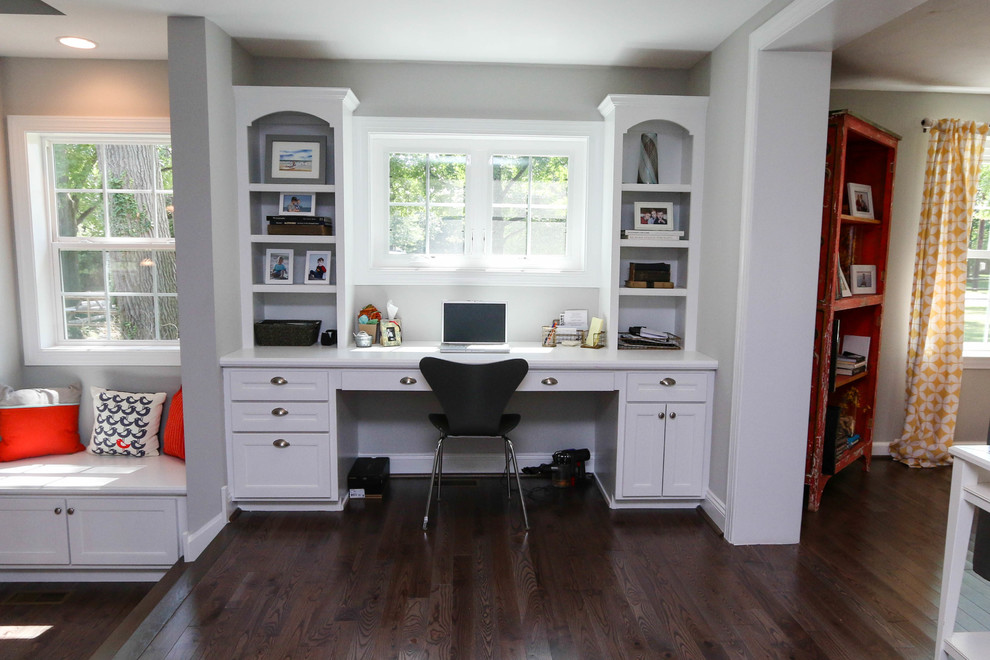 Example of a mid-sized trendy built-in desk dark wood floor study room design in Philadelphia with gray walls