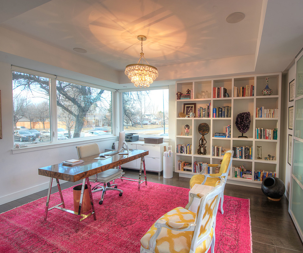 Example of a mid-sized eclectic freestanding desk dark wood floor home office library design in Denver with white walls