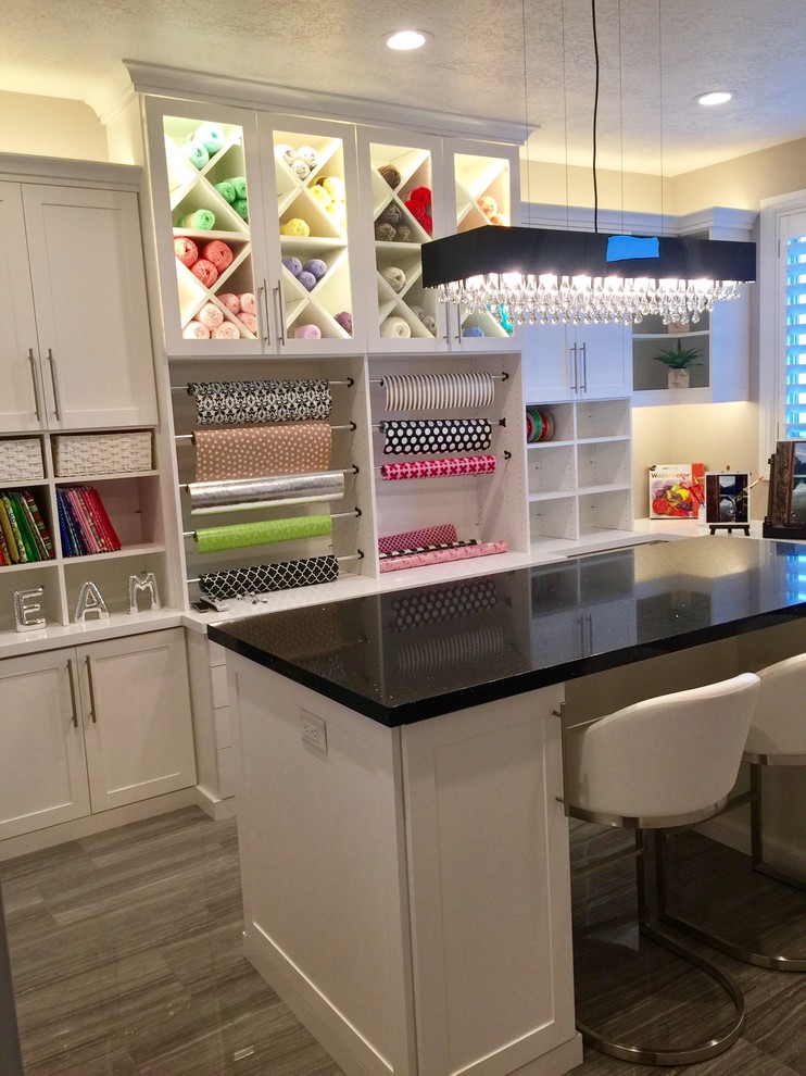 Example of a large transitional freestanding desk laminate floor and gray floor craft room design in Salt Lake City with beige walls