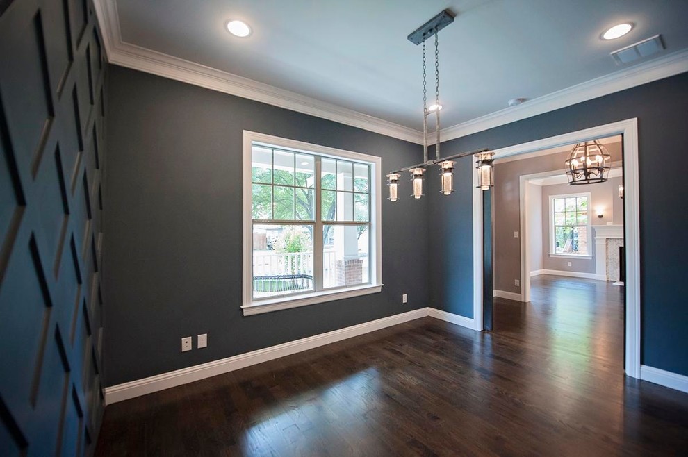 This is an example of a medium sized traditional study in Dallas with grey walls and dark hardwood flooring.