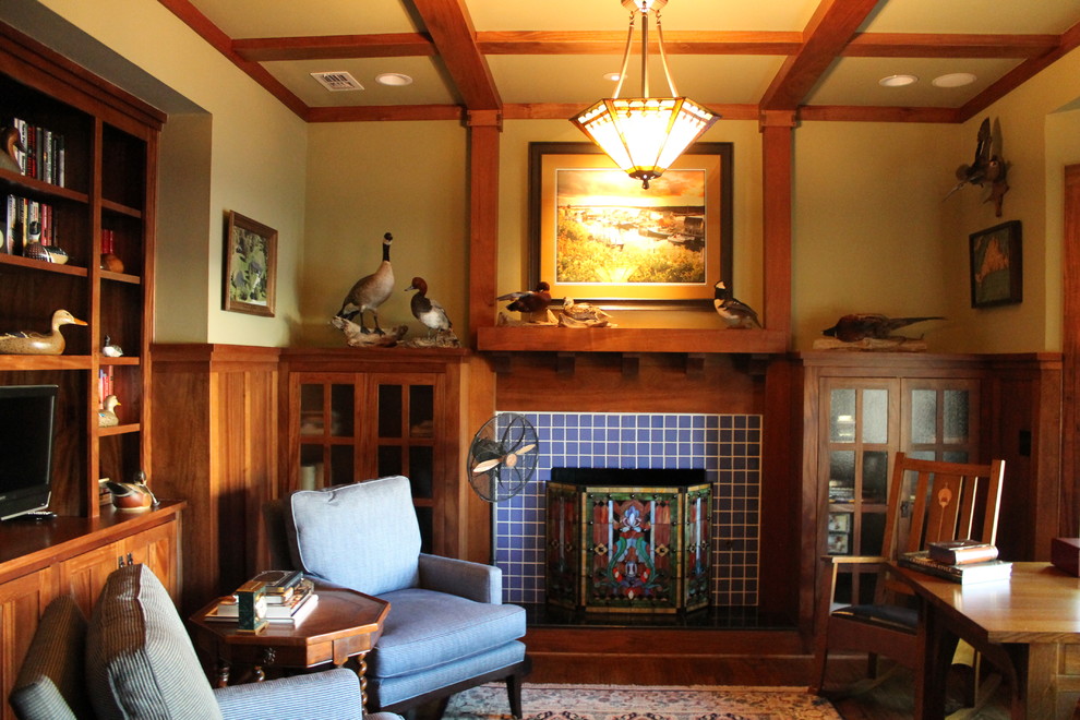 Mid-sized arts and crafts freestanding desk medium tone wood floor home office photo in Dallas with green walls, a standard fireplace and a tile fireplace