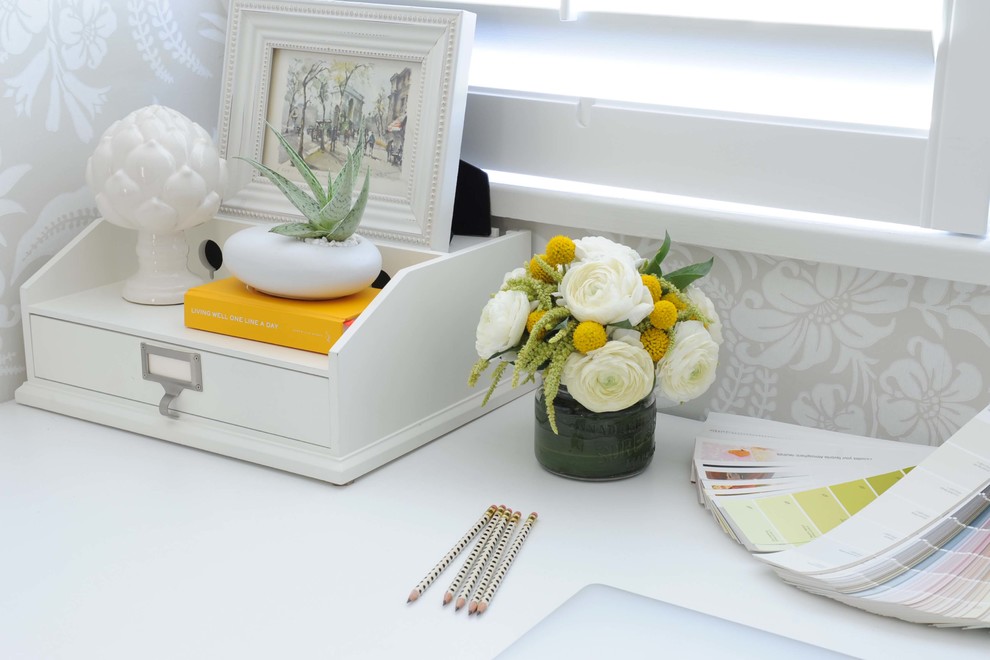 Inspiration for a small timeless built-in desk dark wood floor craft room remodel in Vancouver with gray walls and no fireplace