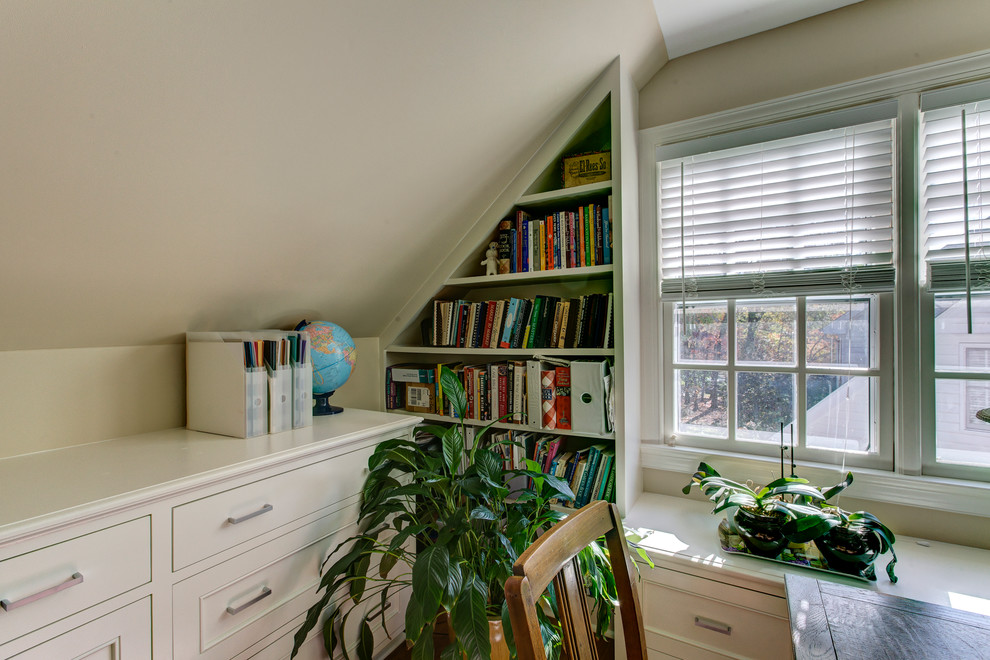 Photo of a medium sized traditional study in Raleigh with beige walls, light hardwood flooring, no fireplace and a freestanding desk.