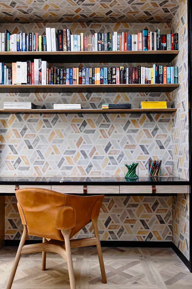 Inspiration for a contemporary home office in Melbourne with multi-coloured walls and a built-in desk.