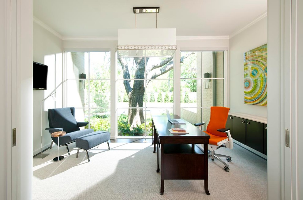 Example of a trendy freestanding desk carpeted home office design in Dallas with gray walls