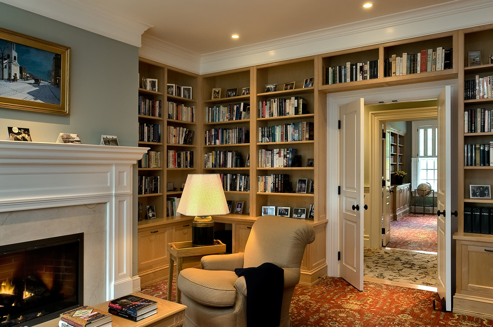 Example of a classic carpeted home office design in New York with gray walls
