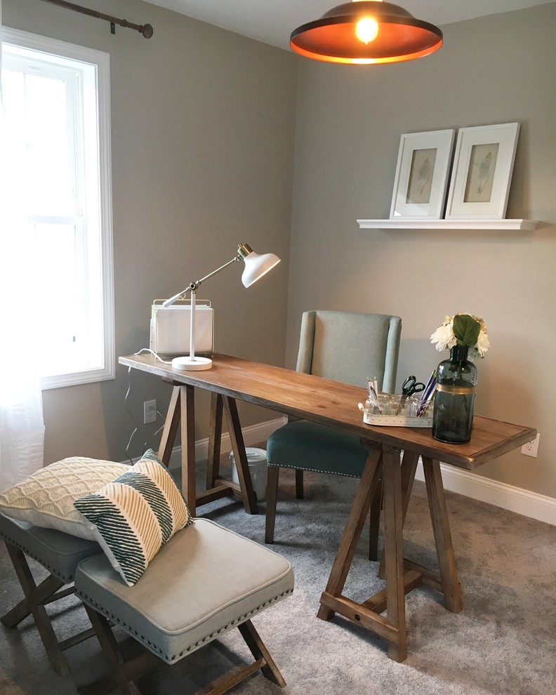 Example of a mid-sized transitional freestanding desk carpeted home office design in Boston with gray walls