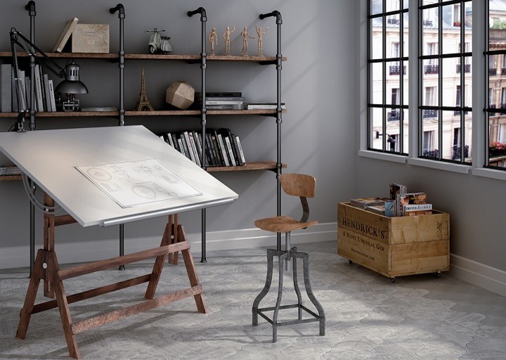 Idee per un atelier industriale di medie dimensioni con pareti grigie, pavimento in gres porcellanato e scrivania autoportante