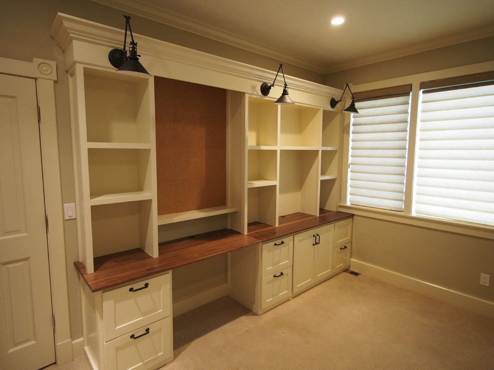 Design ideas for a large classic home office in Denver with beige walls, carpet and a built-in desk.