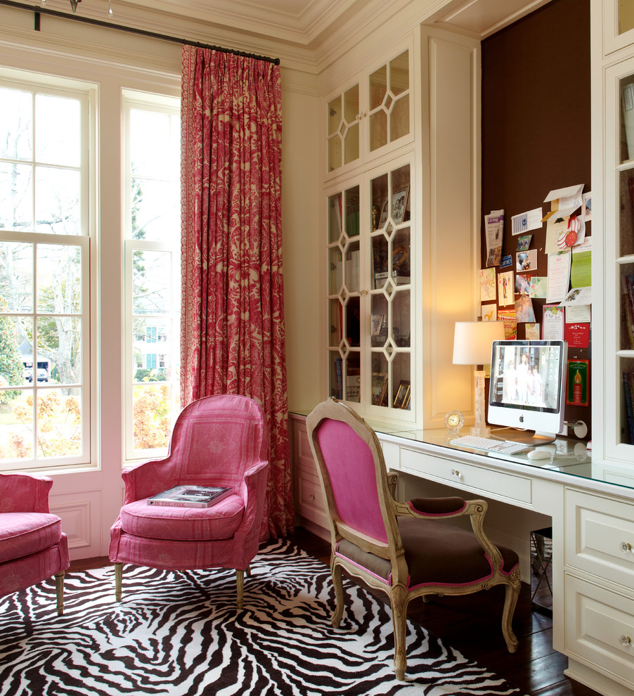 Home office - traditional built-in desk dark wood floor home office idea in New York with white walls
