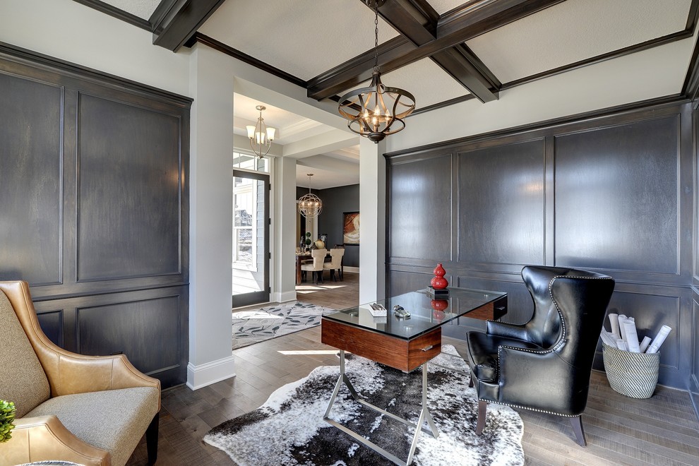 Inspiration for a mid-sized timeless freestanding desk home office remodel in Minneapolis with no fireplace and white walls