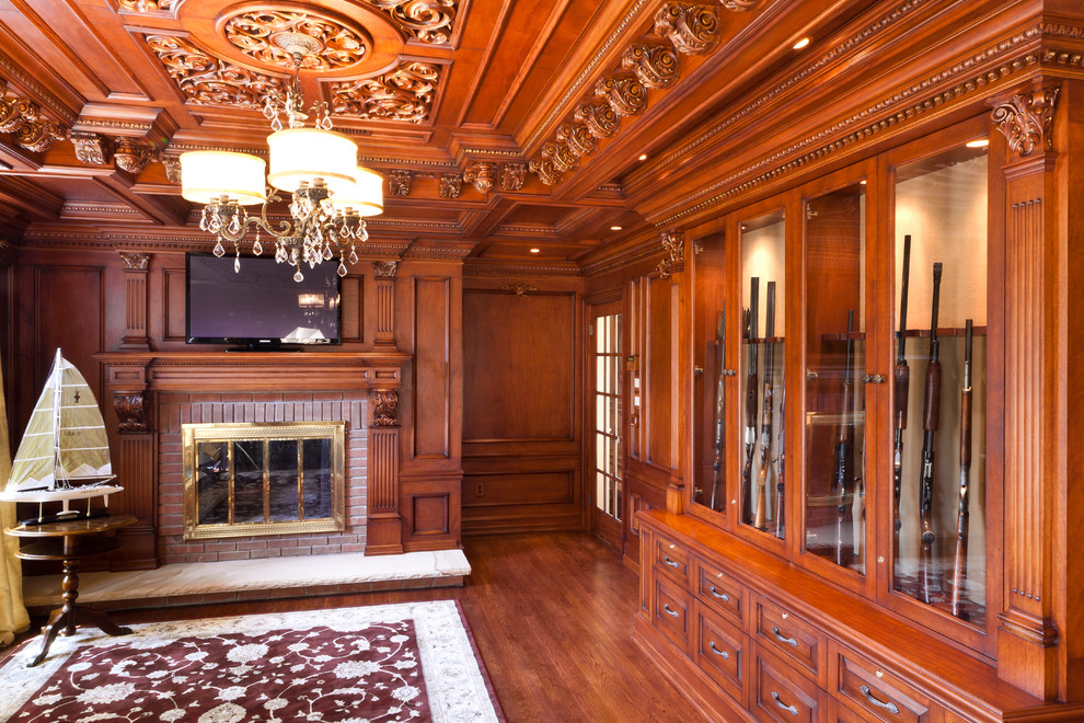 Example of a mid-sized classic freestanding desk marble floor study room design in New York with brown walls, a standard fireplace and a stone fireplace