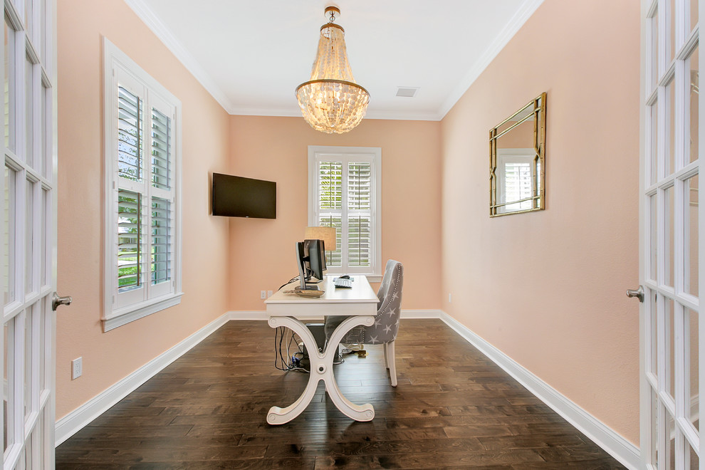 Example of a small beach style freestanding desk dark wood floor home office design in Tampa with orange walls