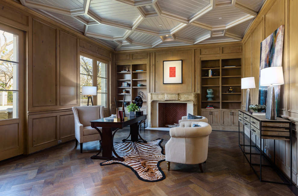 Foto de despacho mediterráneo grande con paredes marrones, escritorio independiente, suelo de madera oscura, todas las chimeneas y suelo marrón