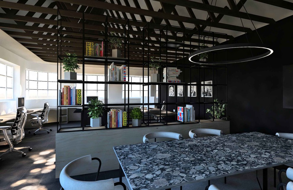 Idee per un atelier minimalista di medie dimensioni con pareti grigie, pavimento in cemento, scrivania incassata e pavimento grigio