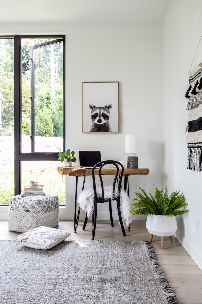 Small danish freestanding desk light wood floor study room photo in Vancouver with white walls