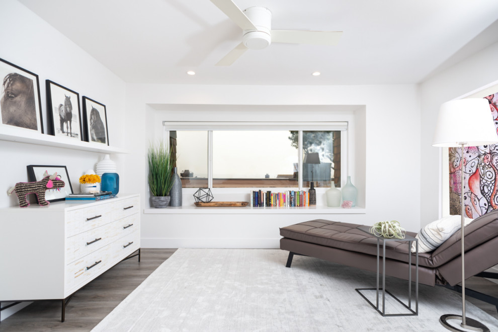 Inspiration for a large modern master bedroom in San Diego with white walls, vinyl flooring and grey floors.