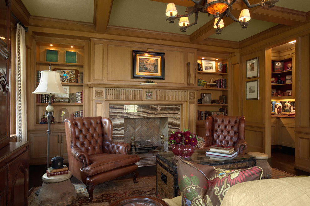ミネアポリスにある中くらいなトラディショナルスタイルのおしゃれなホームオフィス・書斎 (濃色無垢フローリング、標準型暖炉、石材の暖炉まわり) の写真