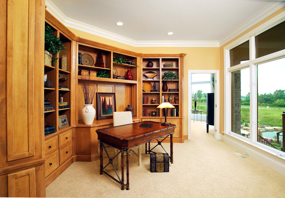 Inspiration for a mid-sized craftsman freestanding desk carpeted and beige floor study room remodel in Other with yellow walls and no fireplace