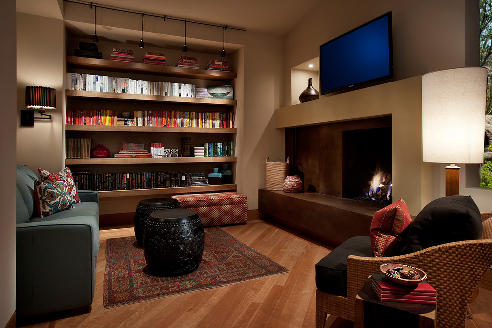 フェニックスにあるコンテンポラリースタイルのおしゃれなホームオフィス・書斎 (標準型暖炉、コンクリートの暖炉まわり) の写真
