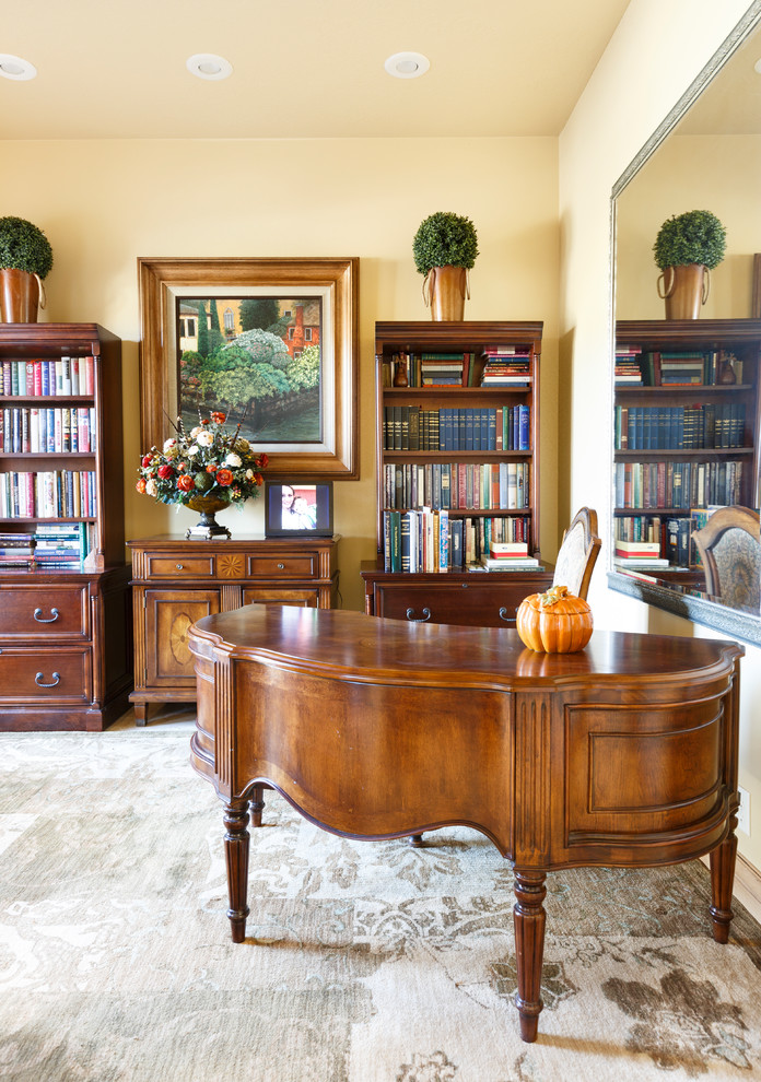 Inspiration for a mid-sized timeless freestanding desk marble floor and beige floor home office library remodel in Salt Lake City with beige walls