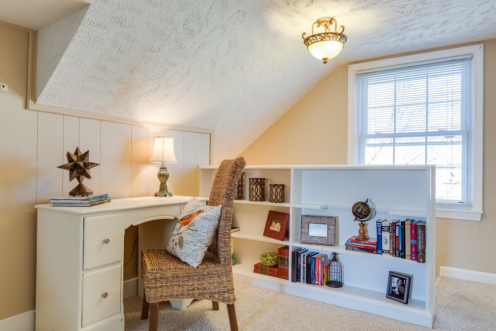 Design ideas for a country home office in Louisville with beige walls and carpet.