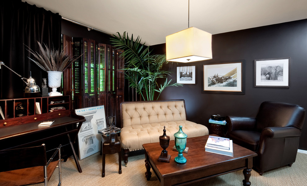 This is an example of a traditional home office in Richmond with black walls, carpet and a freestanding desk.