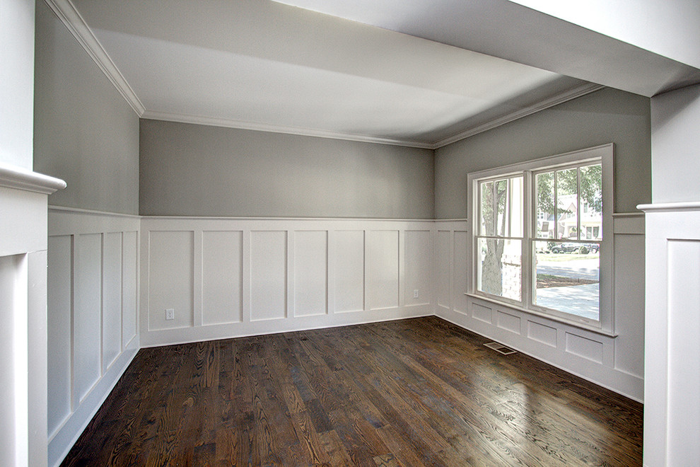 Inspiration for a mid-sized craftsman dark wood floor study room remodel in Charlotte with gray walls