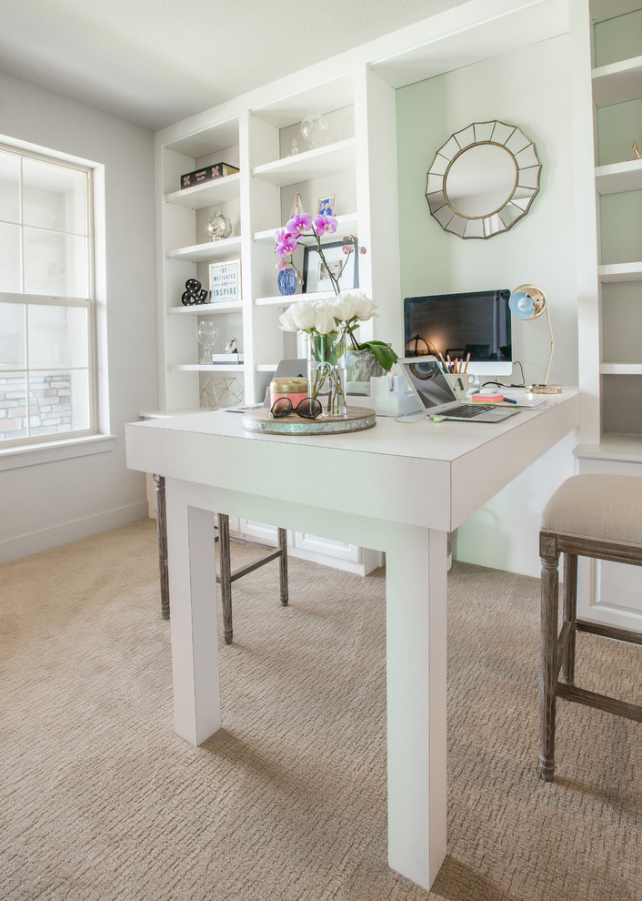 Inspiration for a mid-sized transitional freestanding desk carpeted and beige floor study room remodel in Denver with white walls